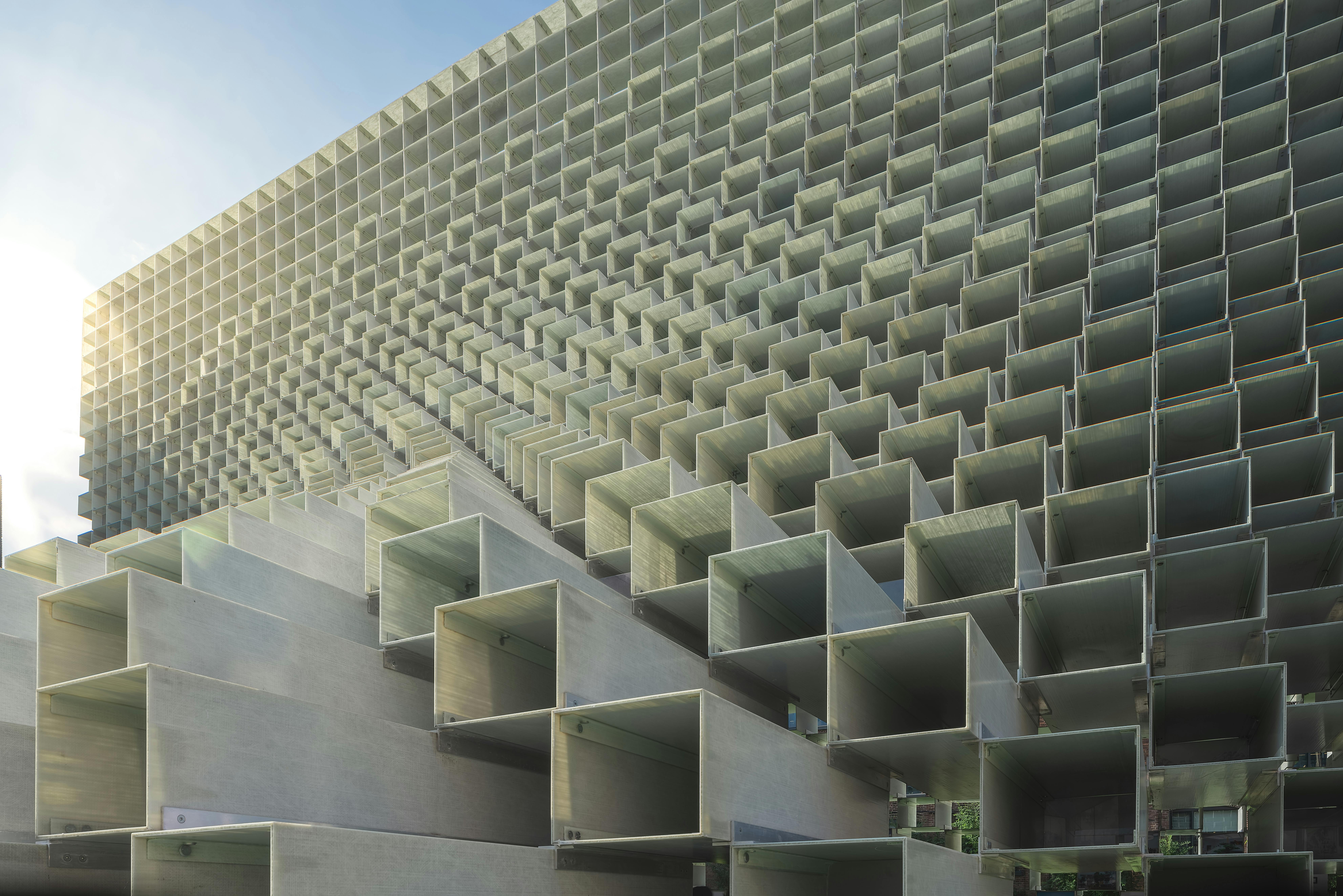 A white building consisted of many small rectangular rooms on top of each other